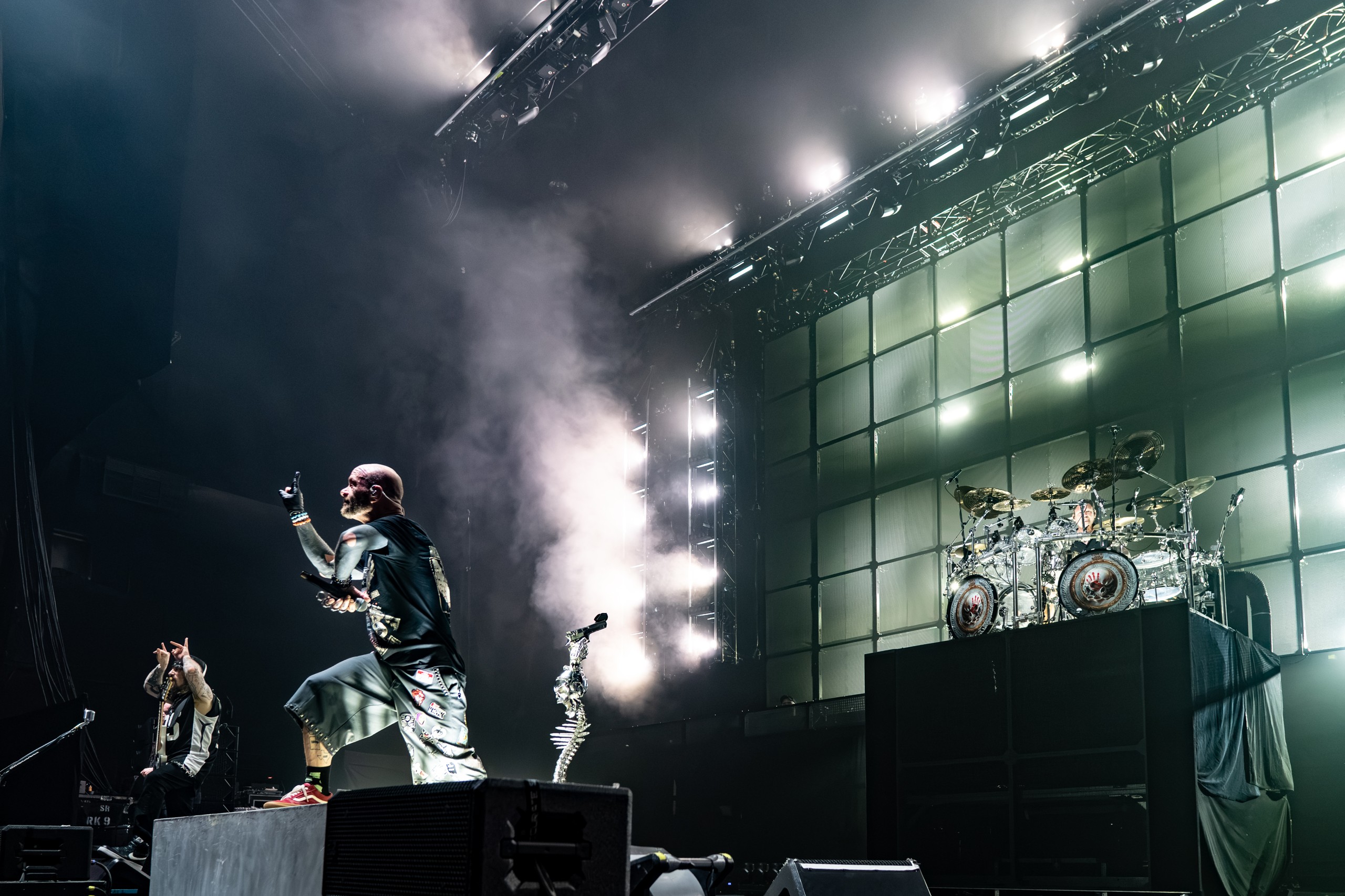 Wide view of Five Finger Death Punch onstage amid white lights and smoke. Five Finger Death Punch at Coastal Credit Union Music Park, Raleigh, October 14, 2026.