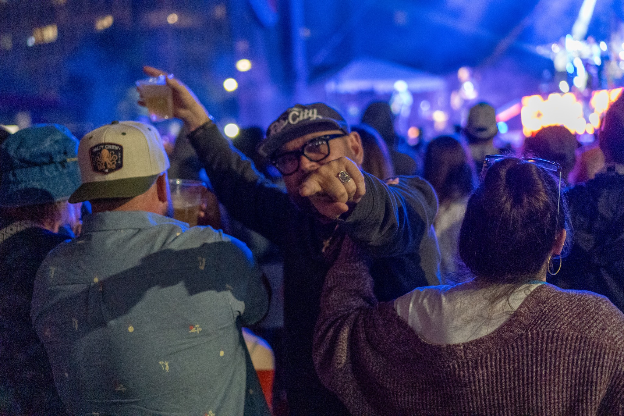 Fans watching Iration under blue light.