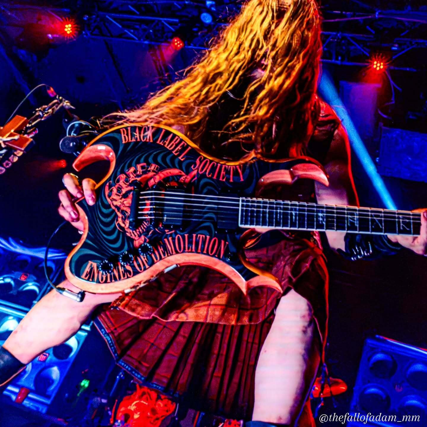 Zakk Wylde swinging his hair while playing guitar during Black Label Society at The Ritz.