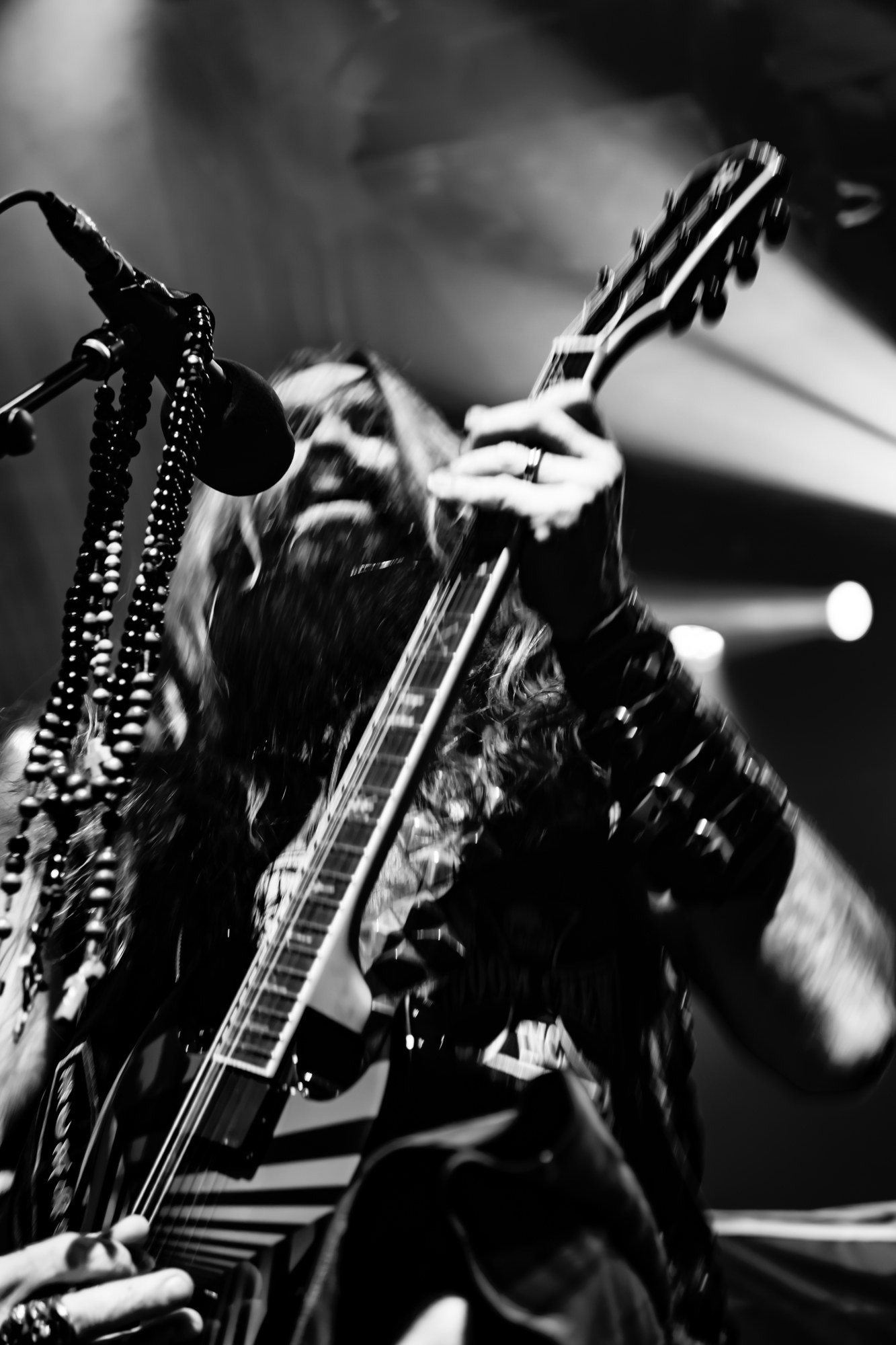 Black and white view of Zakk Wylde holding his guitar aloft at The Ritz.