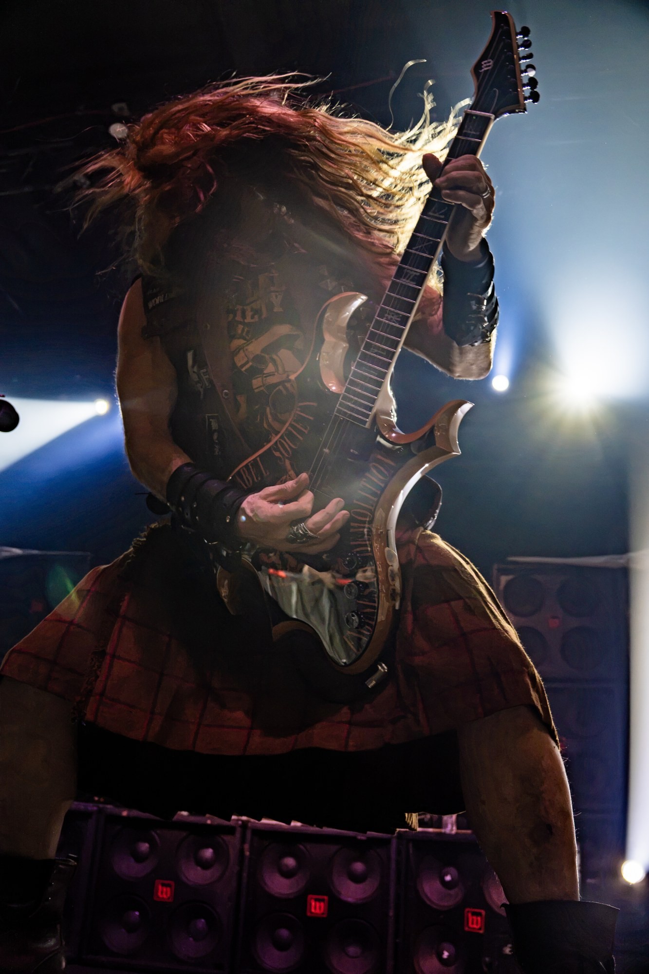 Zakk Wylde raising his guitar beneath the stage lights at The Ritz.