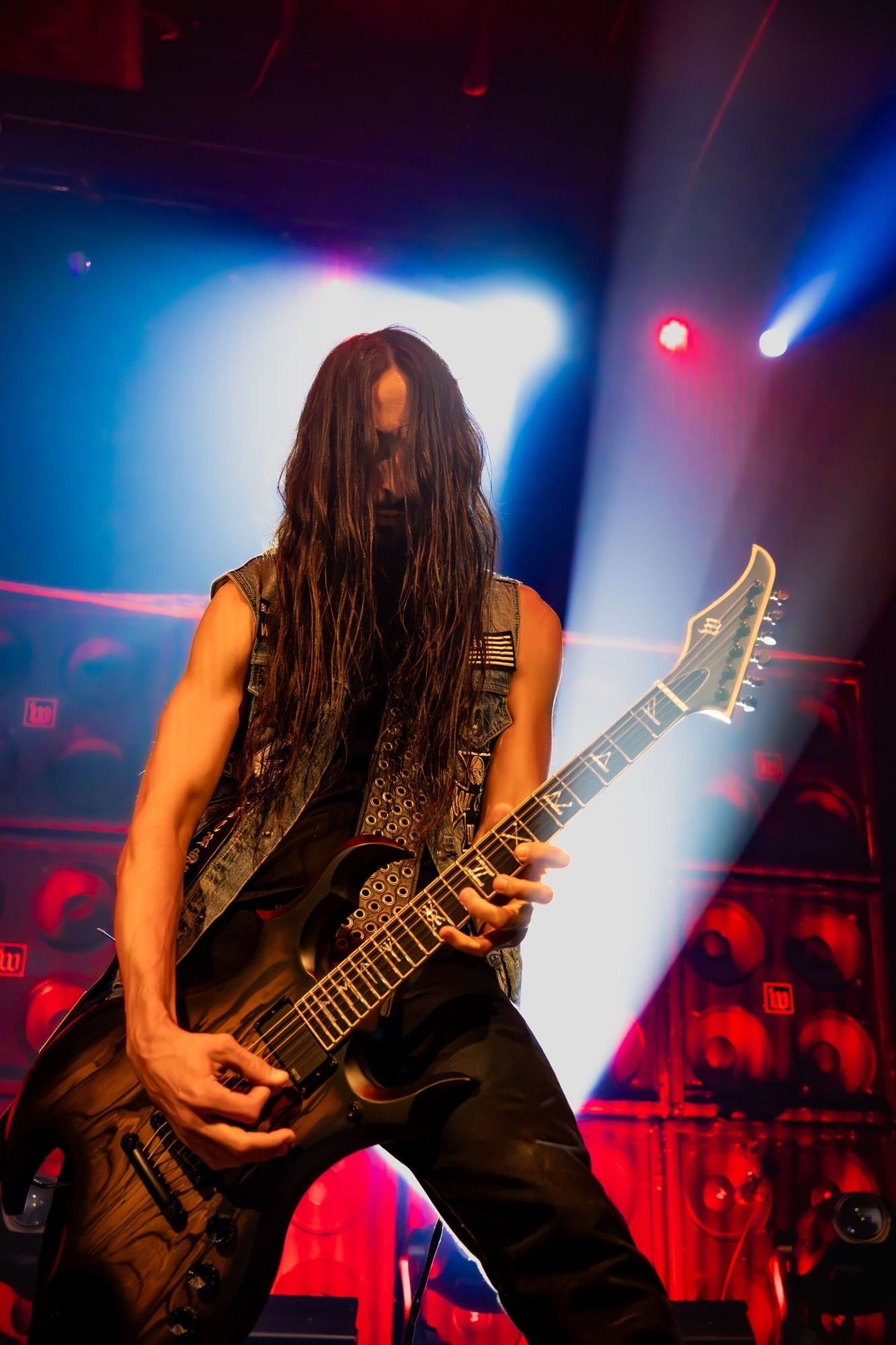 Zakk Wylde playing guitar against red and blue lights at The Ritz.