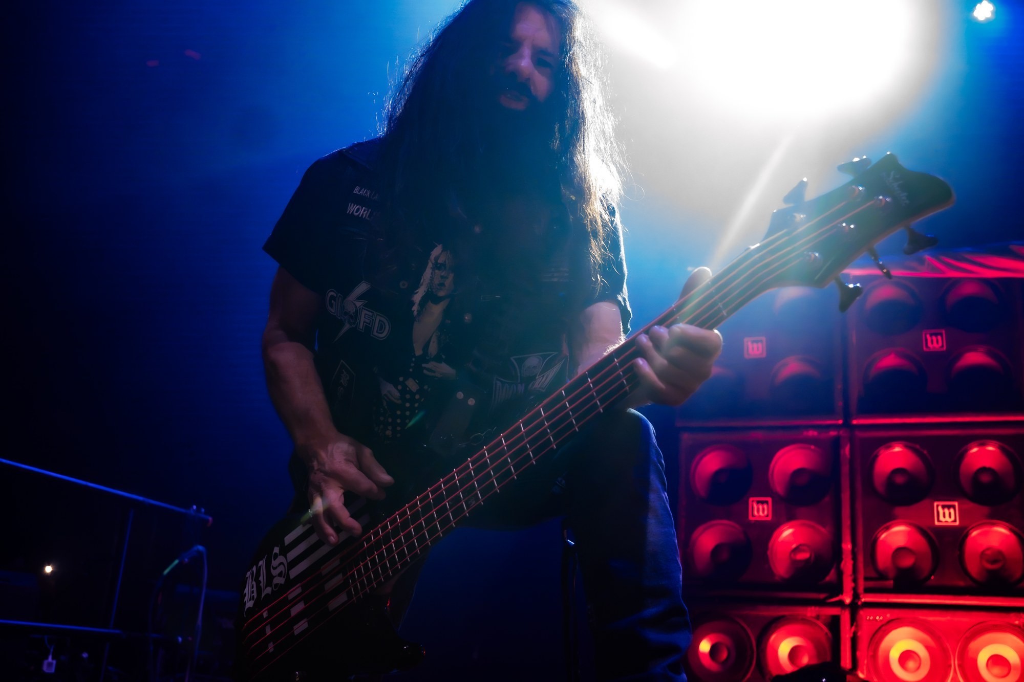 Black Label Society bassist performing beneath blue stage lights at The Ritz.