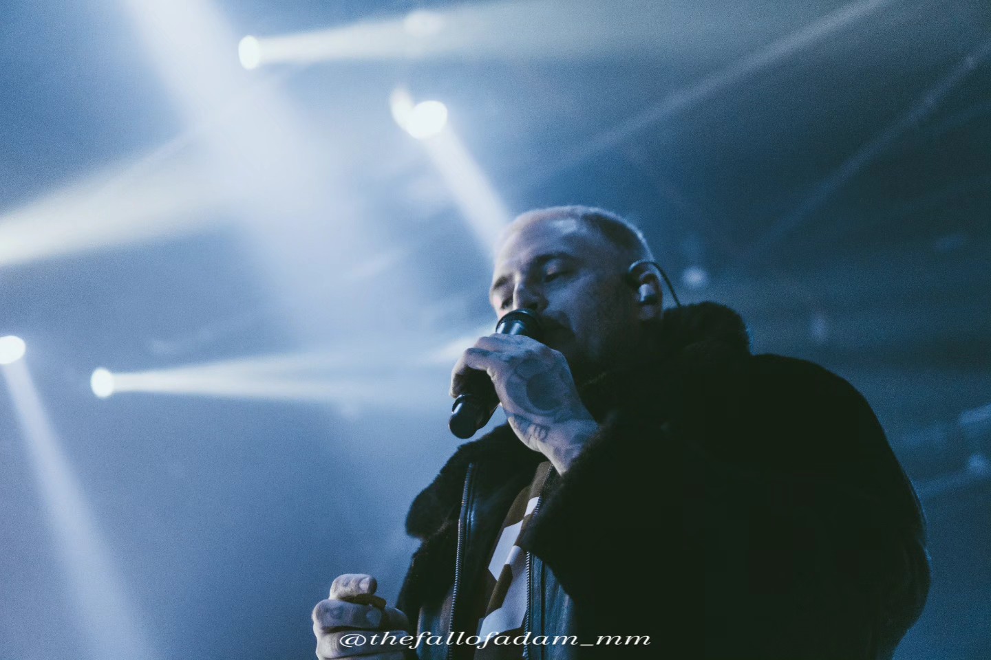 Highly Suspect vocalist singing under blue and white stage lights at The Ritz.