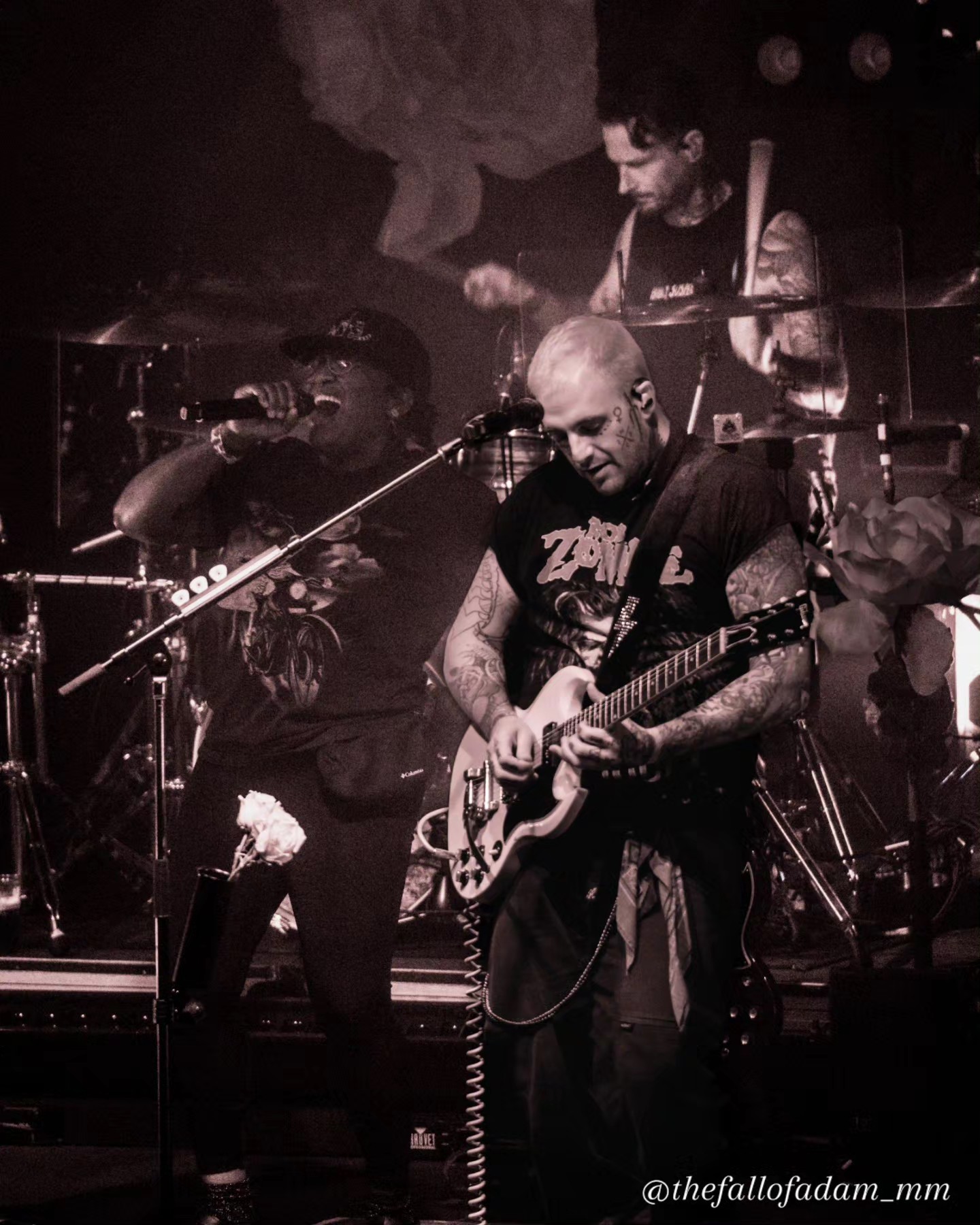 Highly Suspect vocalist and drummer performing together in black and white.