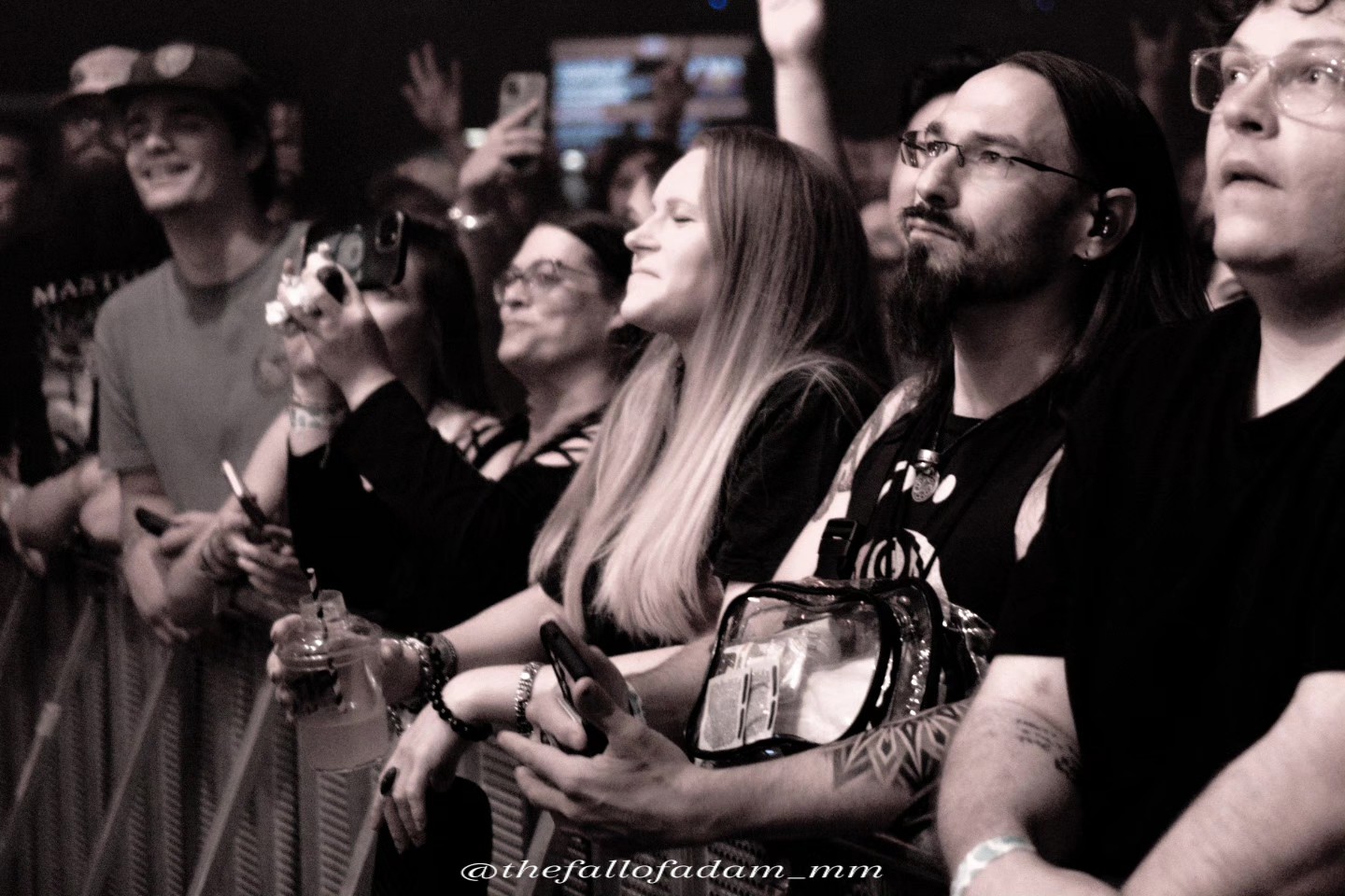 Black and white photograph of fans at the front barrier during Highly Suspect.