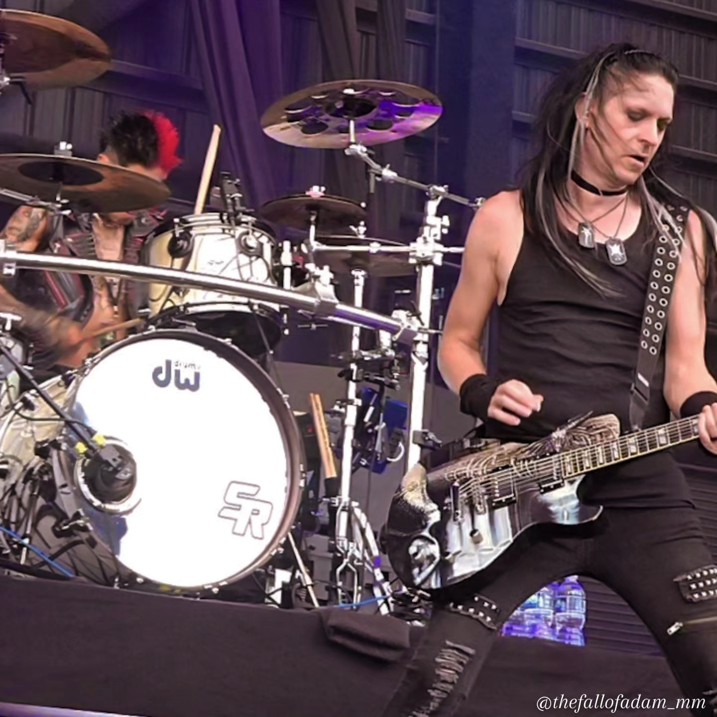 Orgy musician playing beside the drum kit during the Tampa performance.