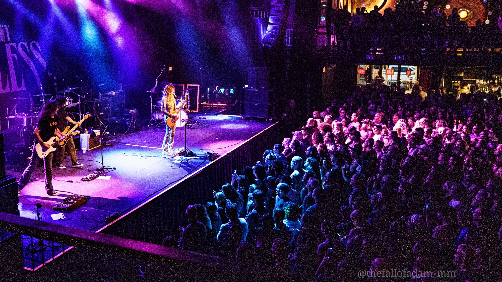 Wide view of Paris Jackson onstage and the audience.