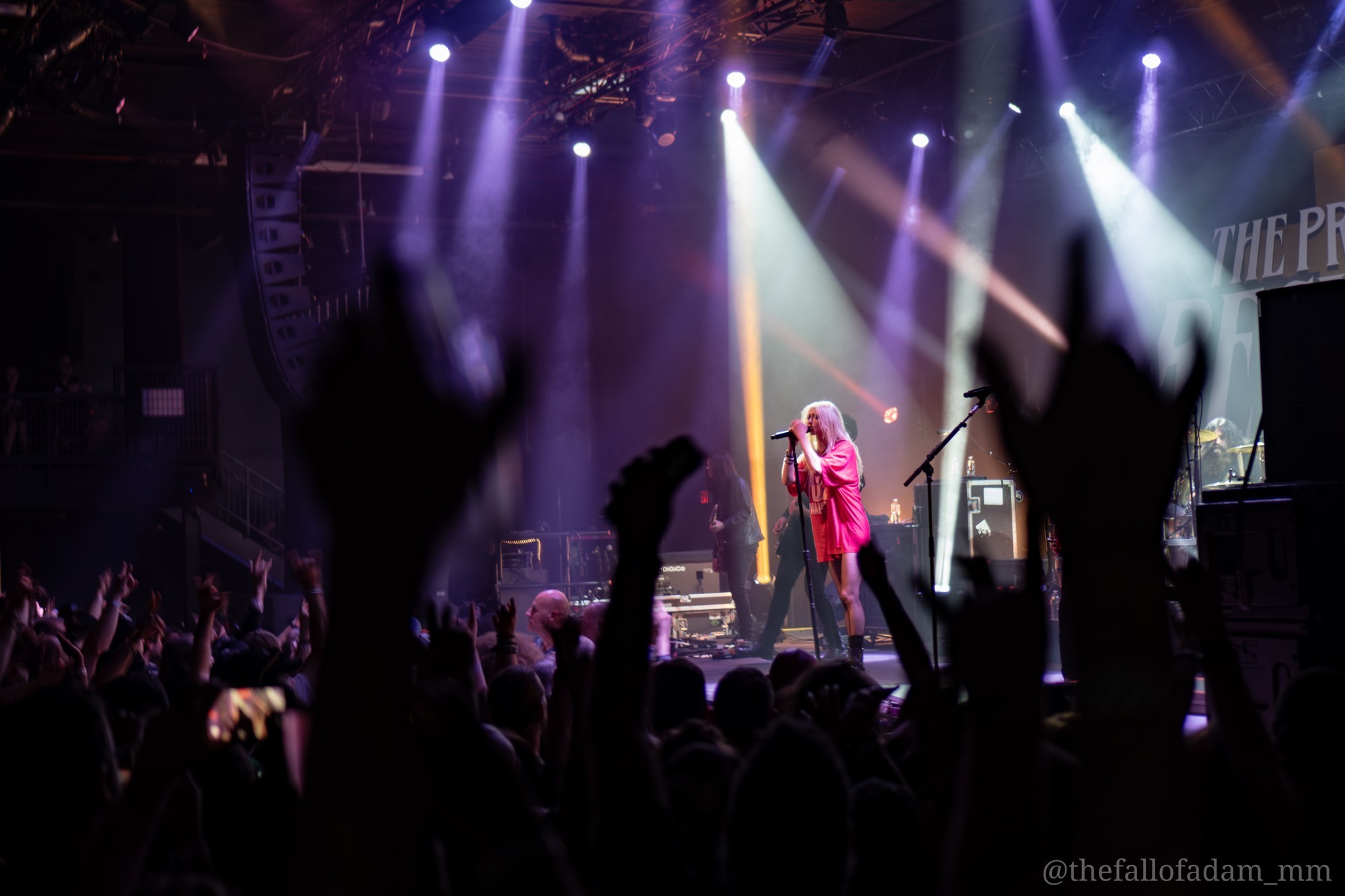 Wide view of The Pretty Reckless stage and audience.