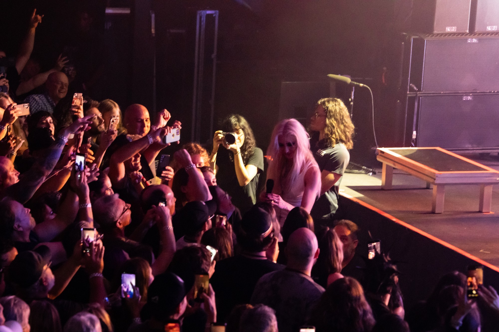 Taylor Momsen approaching fans at the front of the stage.