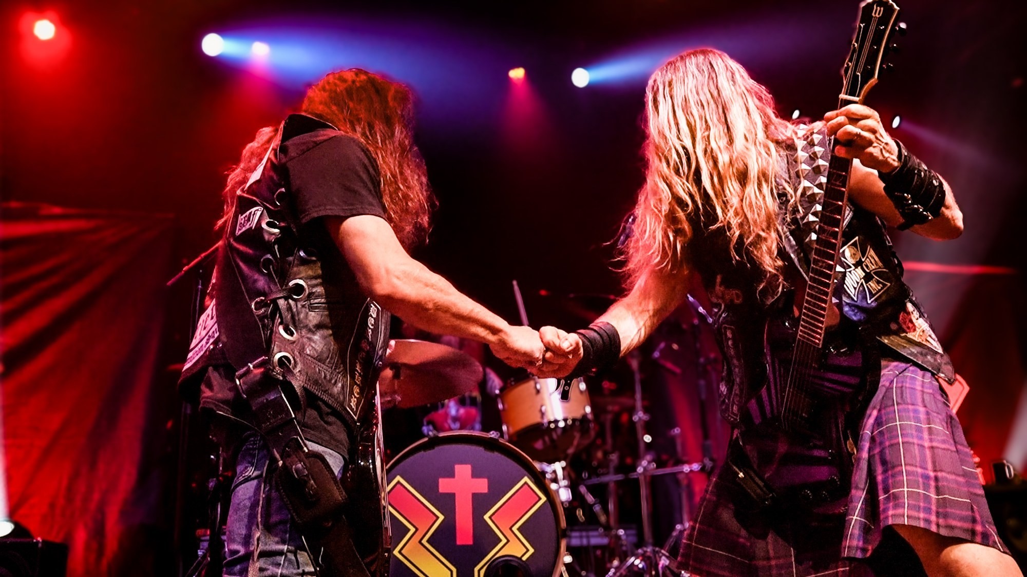 Zakk Sabbath musicians playing together under red stage lights at The Ritz.