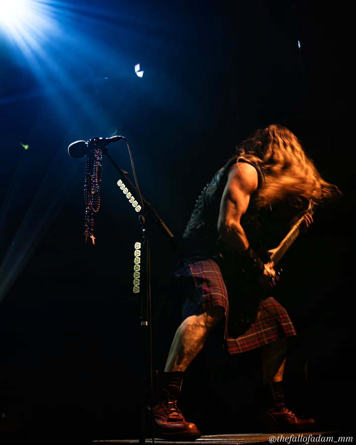 Zakk Wylde looking upward beneath blue lights during Zakk Sabbath at The Ritz.