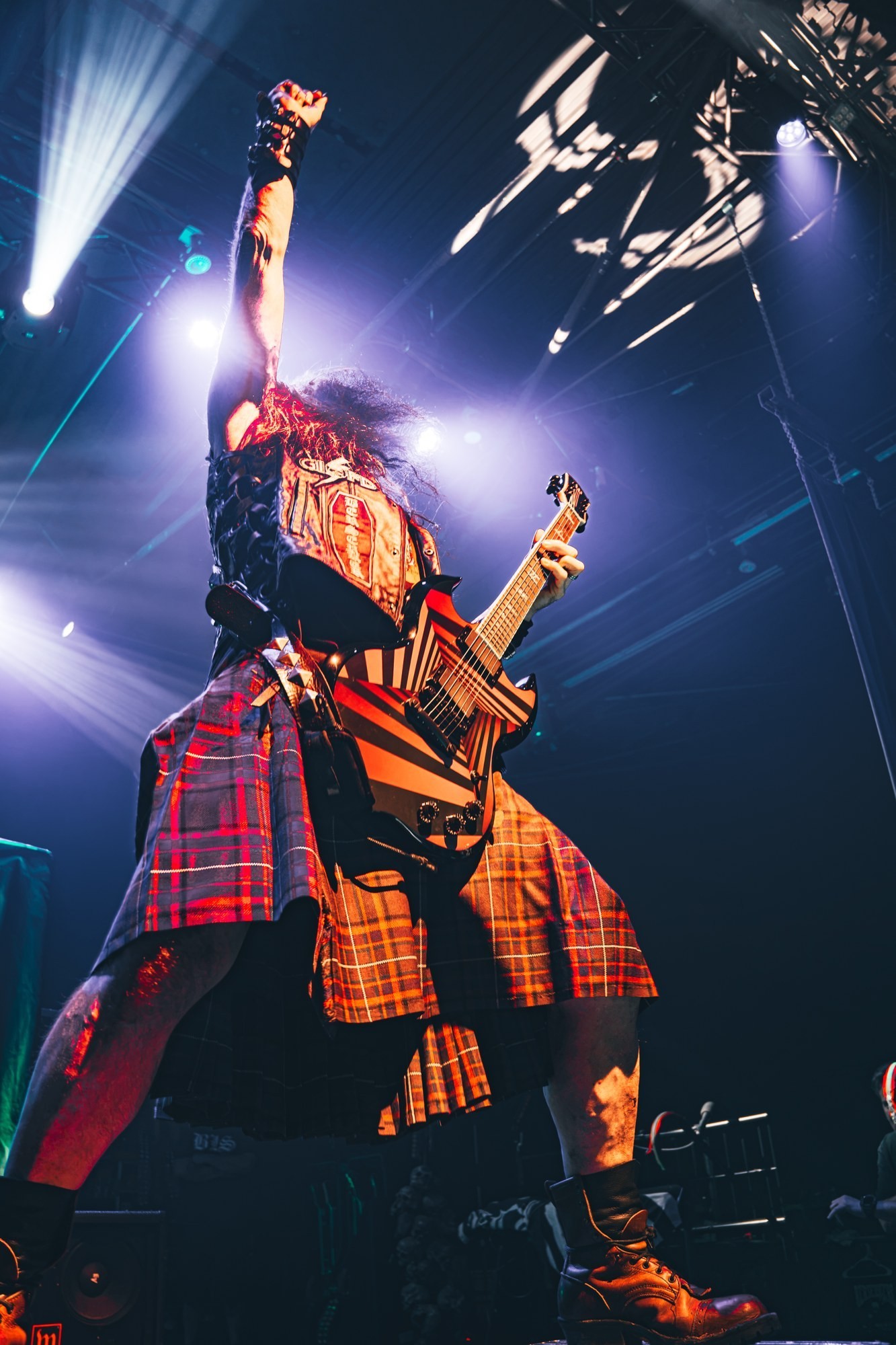 Zakk Wylde playing guitar beneath blue stage lights during Zakk Sabbath at The Ritz.