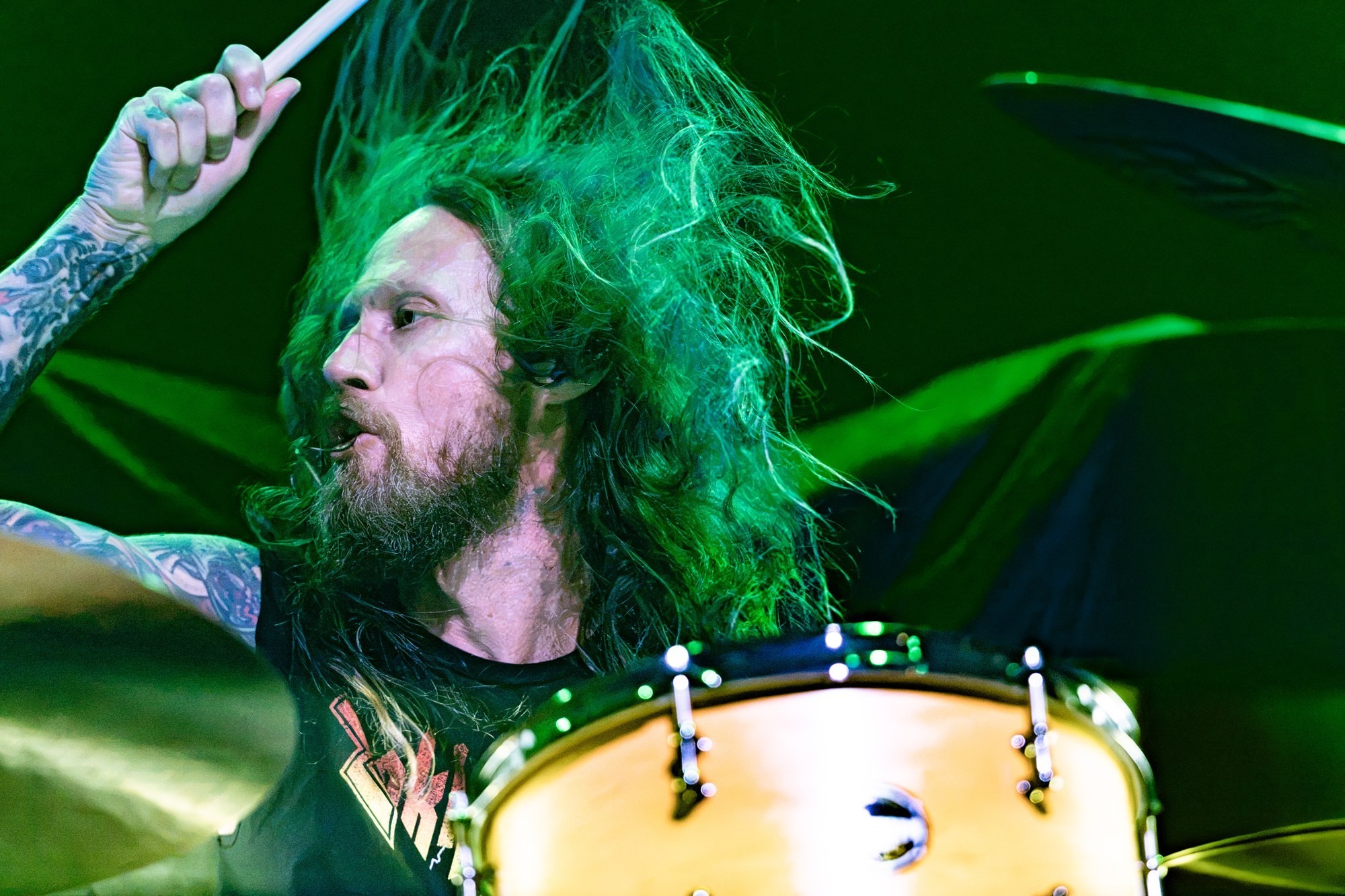Zakk Sabbath drummer at his kit under green stage lights at The Ritz.